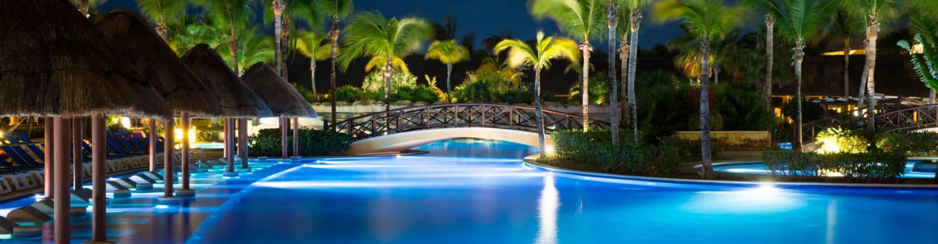 swimming pool in night illumination. tropical resort at night