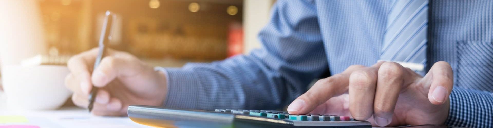 Business finance man calculating budget numbers, Invoices and financial adviser working.